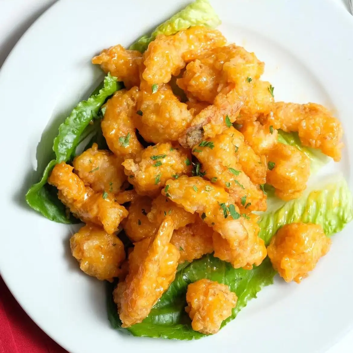 Asian-Cafe-Asian-Fusion-restaurant-Rocky-Shrimp-Fayetteville Rocky Shrimp - Crispy fried shrimp with orange sauce on lettuce at Asian Cafe, a Asian Fusion restaurant in Fayetteville
