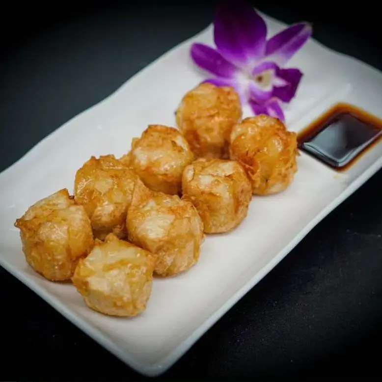 Asian-Cafe-Asian-Fusion-restaurant-Fried-Shumai-Fayetteville Fried Shumai - Deep - fried shrimp dumplings served with soy sauce at Asian Cafe, a Asian Fusion restaurant in Fayetteville